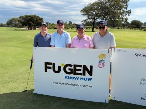 4 Fugen team members standing in front of a large sponsorship card with the Fugen logo on it, all dressed in golf attire and on the Bonnie Doon golf course for the Giant Steps Golf Day 2026.