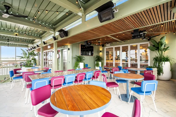 New outdoor dining area at Corrimal Hotel with colourful tables and chairs.