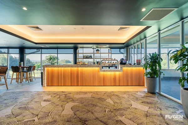 the new bar in the dining area at Worrigee sports club with a brightly lit up front bar and drinks behind, overlooking the golf course